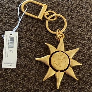 Tory Burch Gold Sun bag charm / key ring.